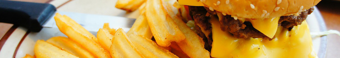 Eating Burger at Burger Delite restaurant in Hyattsville, MD.